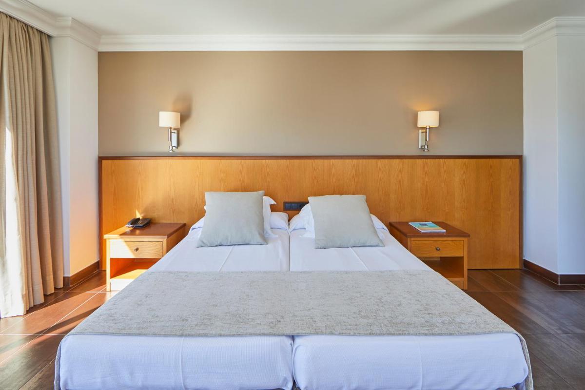 Cama o camas de una habitación en Hotel Playa Golf - Adults Only