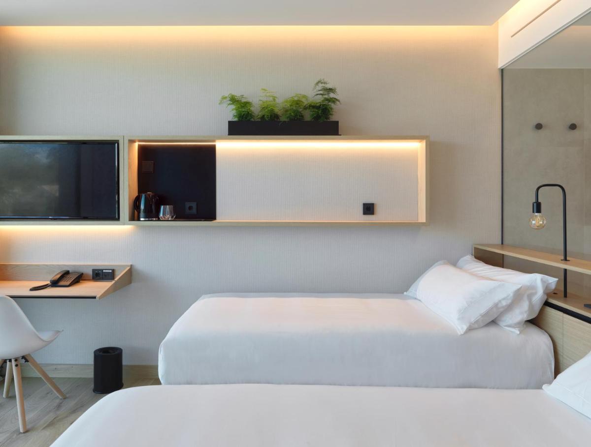 Cama o camas de una habitación en Noa Boutique Hotel