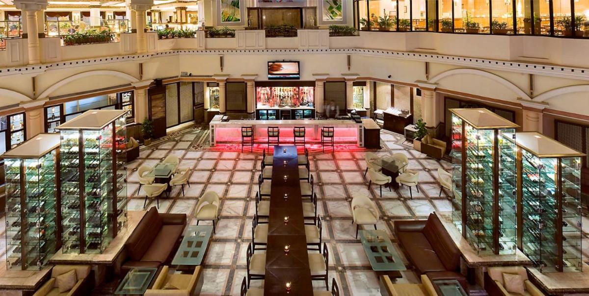 an overhead view of a large building with a lobby at The Suryaa New Delhi in New Delhi an overhead view of a large building with a lobby at The Suryaa New Delhi in New Delhi