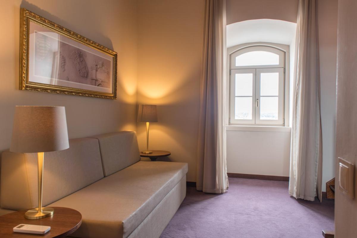 Uma cama ou camas num quarto em Vila Gale Collection Elvas