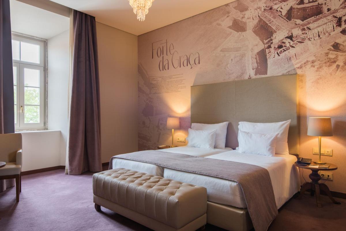 Uma cama ou camas num quarto em Vila Gale Collection Elvas