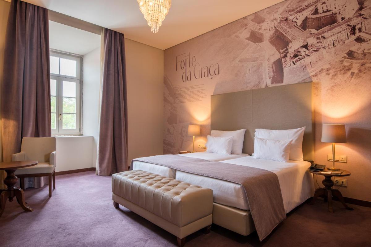 Uma cama ou camas num quarto em Vila Gale Collection Elvas