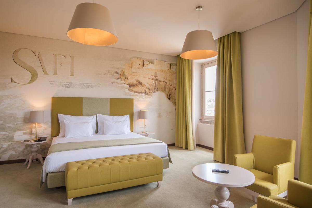 Uma cama ou camas num quarto em Vila Gale Collection Elvas