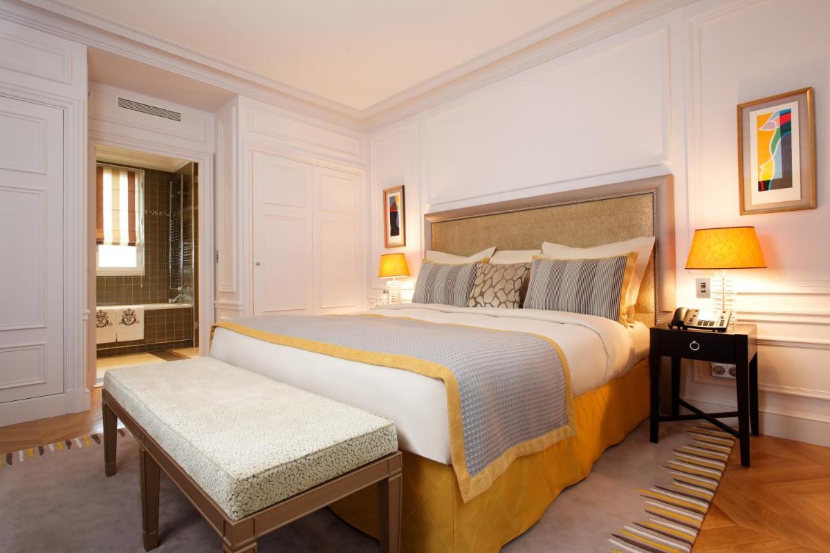 Un ou plusieurs lits dans un hébergement de l'établissement Majestic Apartments Champs Elysées