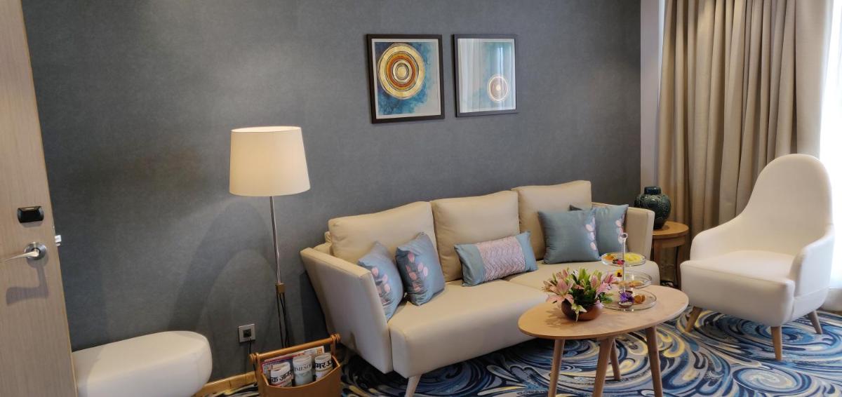 a living room with a couch and two chairs at Welcomhotel by ITC Hotels, Shimla in Shimla