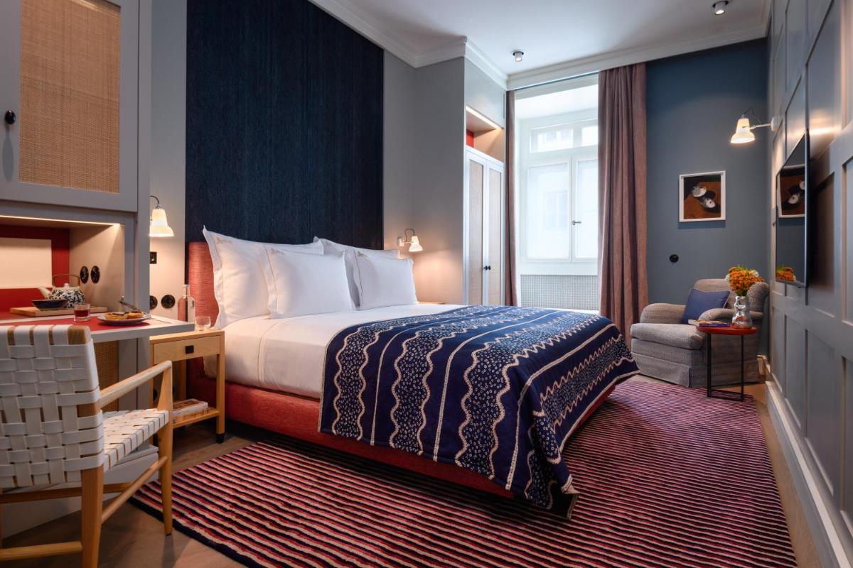 Uma cama ou camas num quarto em Bairro Alto Hotel