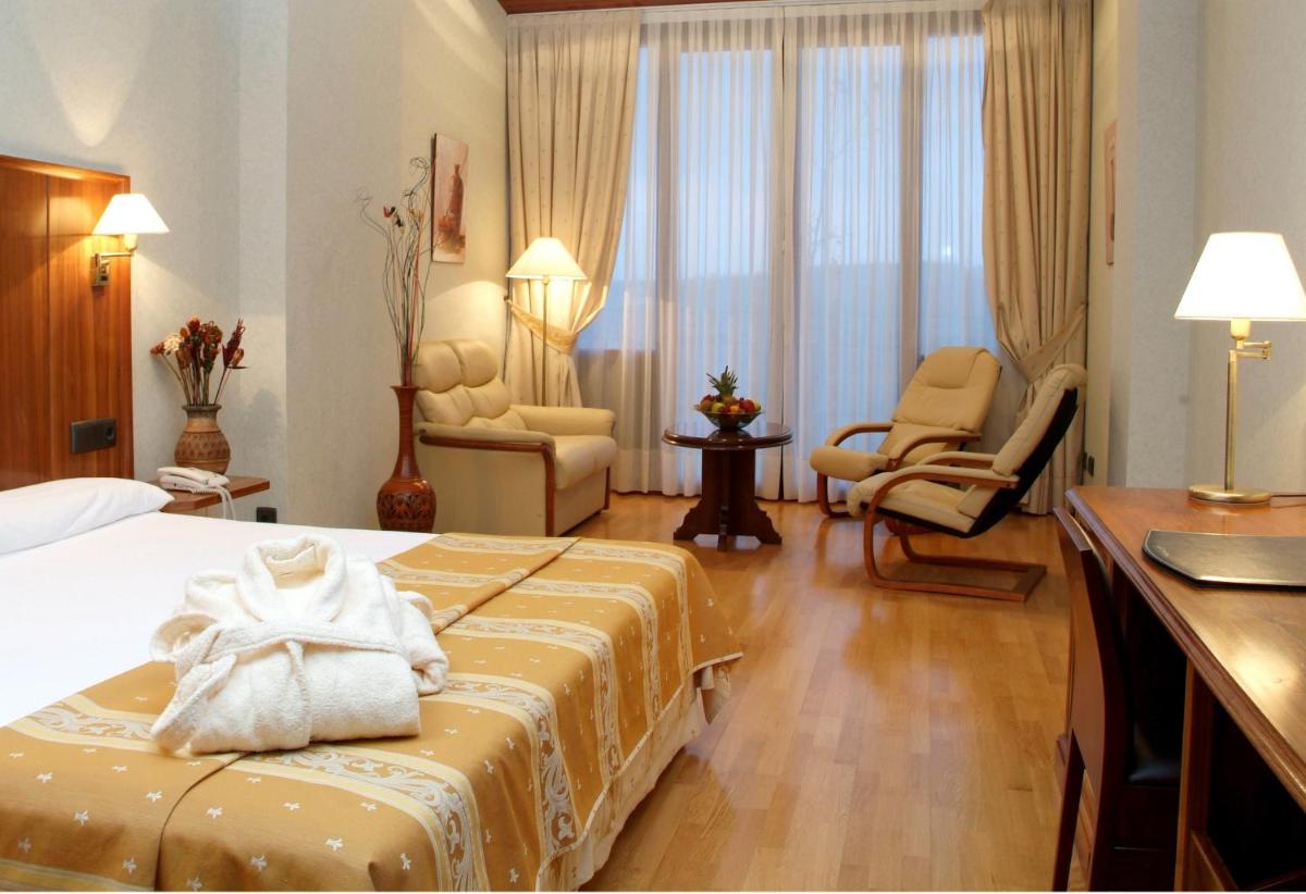Cama o camas de una habitación en Hotel Doña Brígida – Salamanca Forum