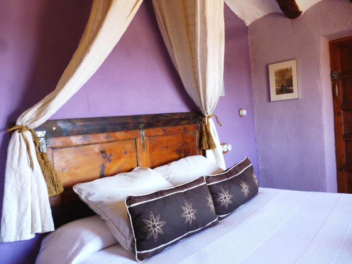 Cama o camas de una habitación en Les Vinyes Alojamiento Rural Boutique & SPA