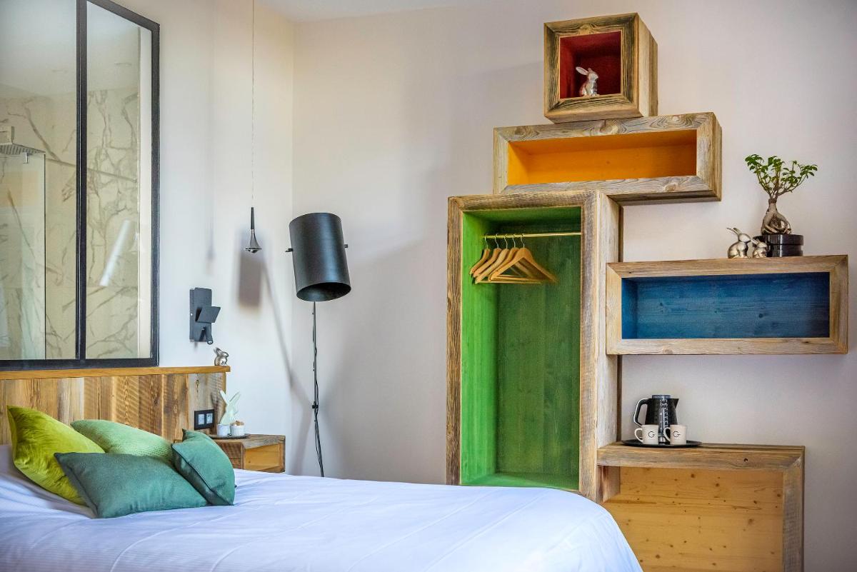 Un ou plusieurs lits dans un hébergement de l'établissement Hôtel La Garenne