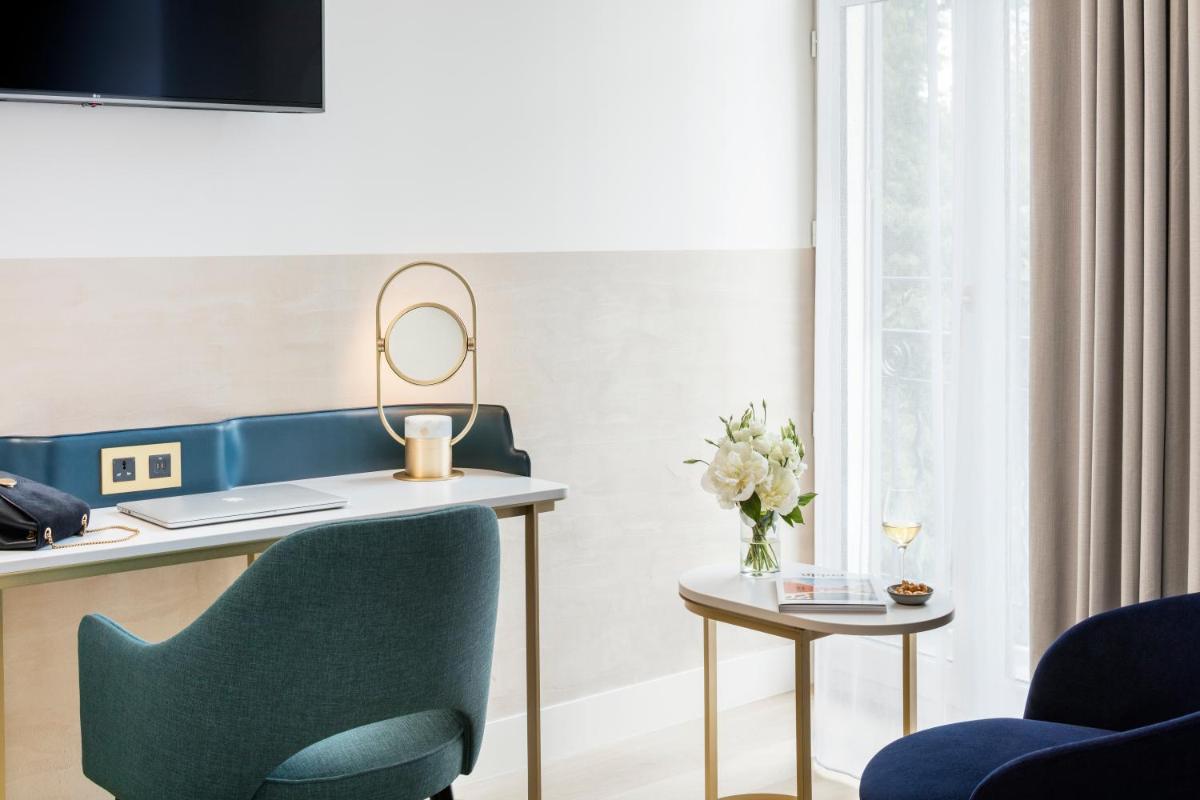 Télévision ou salle de divertissement dans l'établissement Maison Albar Hotels L’Imperator
