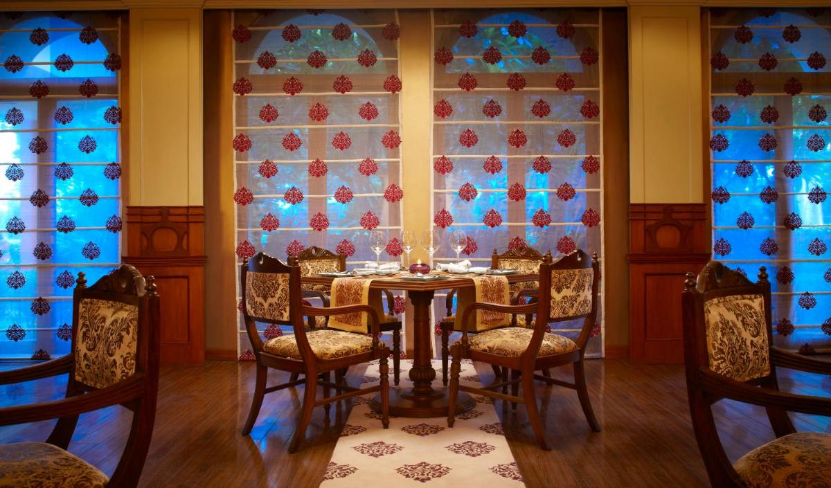 a dining room with a table and chairs at Taj Ganges Varanasi in Varanasi