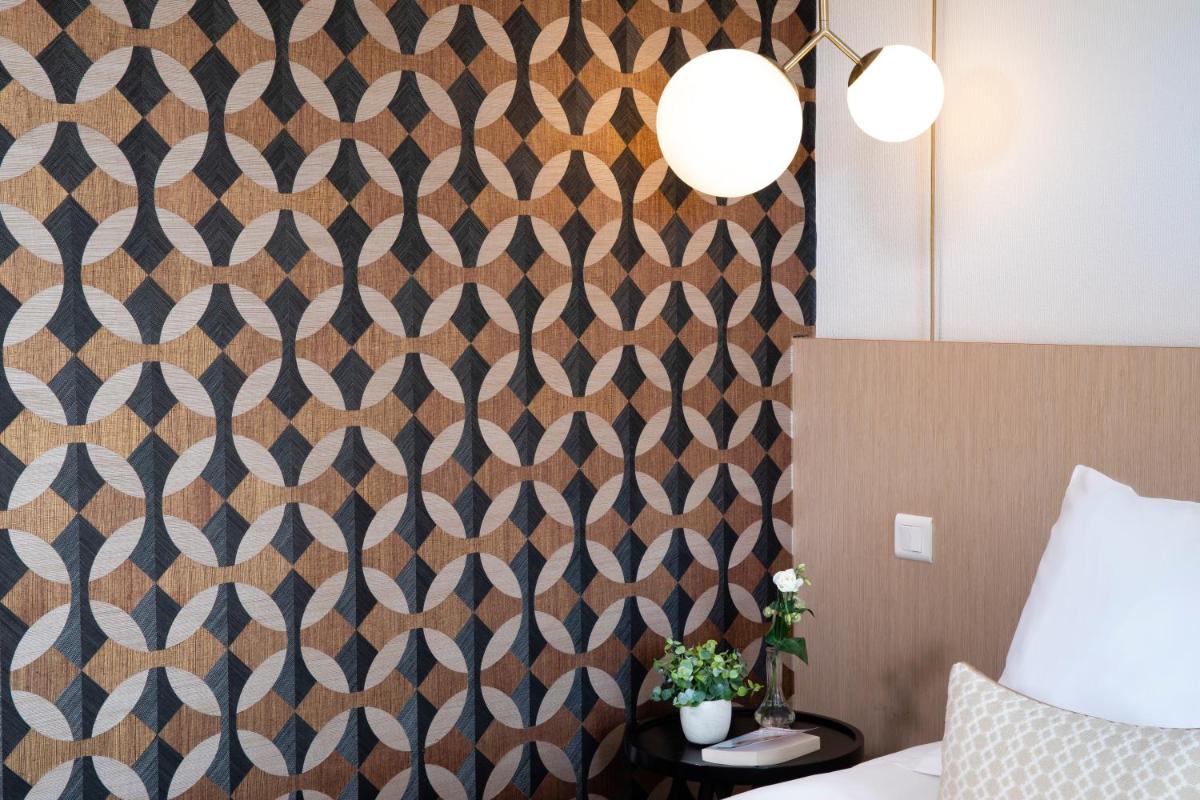 Un ou plusieurs lits dans un hébergement de l'établissement Best Western Plus Hotel les Rives du Ter