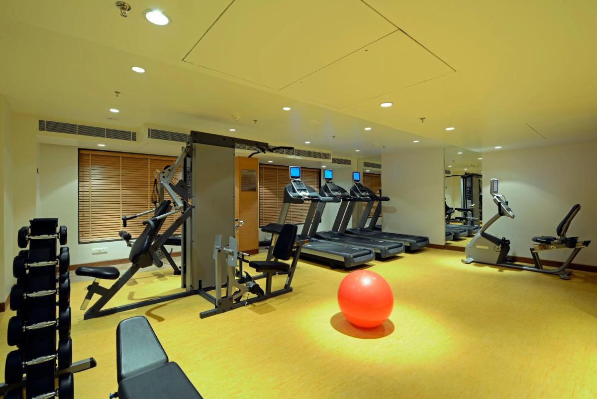 a gym with an orange ball in the middle of a room at Radisson Blu Hotel Ahmedabad in Ahmedabad