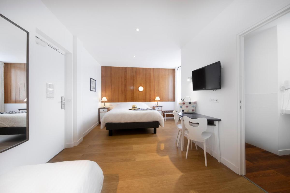 Un ou plusieurs lits dans un hébergement de l'établissement Hôtel Spa De La Citadelle Lorient