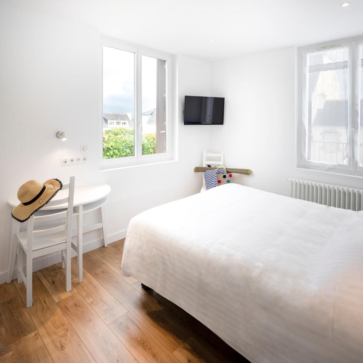 Un ou plusieurs lits dans un hébergement de l'établissement Hôtel Spa De La Citadelle Lorient