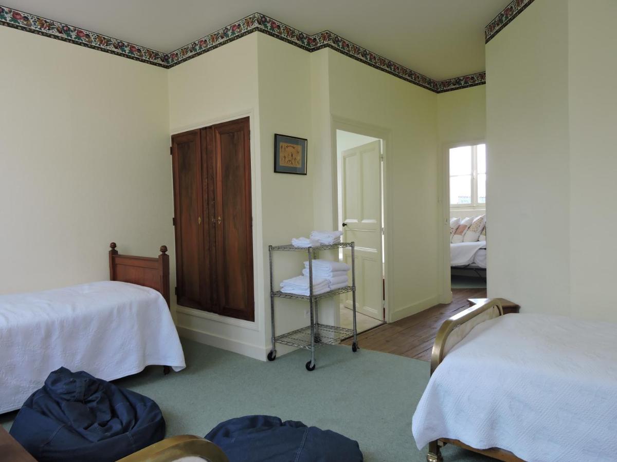 Un ou plusieurs lits dans un hébergement de l'établissement Le Domaine de Mestré, The Originals Relais