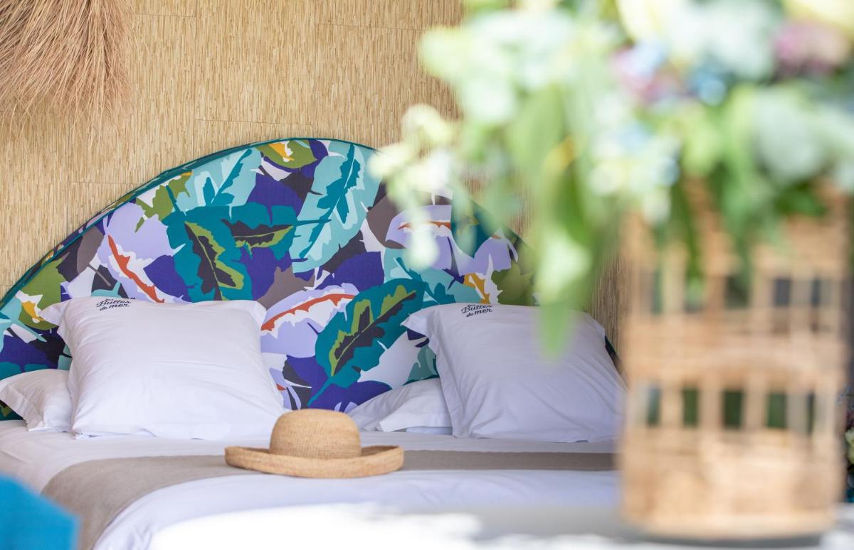 Un ou plusieurs lits dans un hébergement de l'établissement Les Bulles de Mer - Hotel & Spa sur la Plage