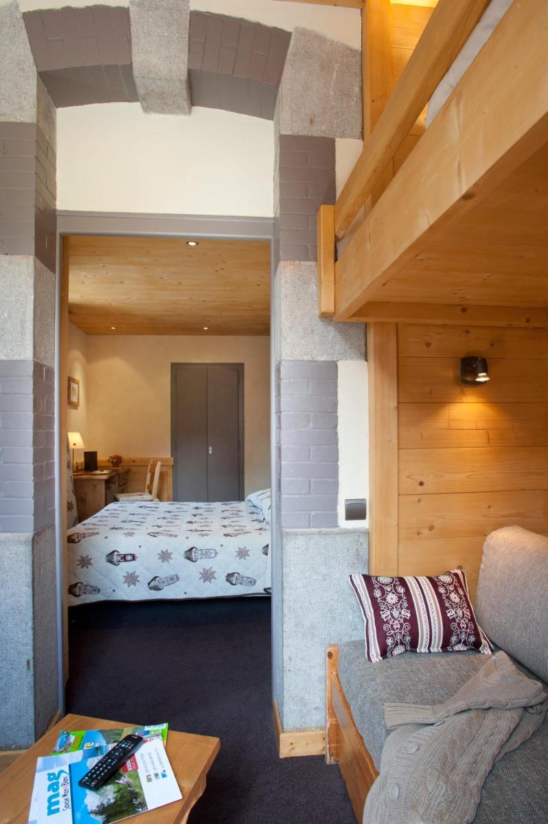 Un ou plusieurs lits dans un hébergement de l'établissement Logis Hotel & Spa Beau-Site