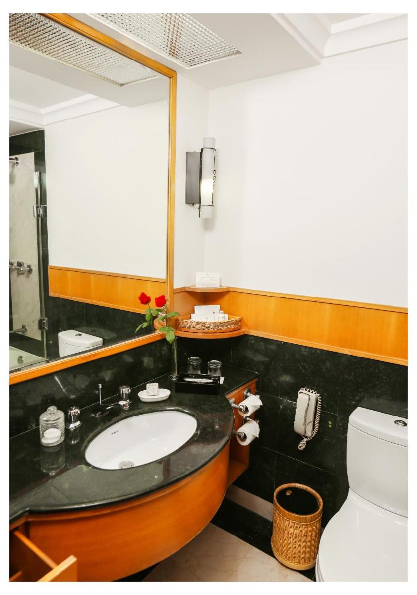 a bathroom with a sink and a toilet at Trident Chennai in Chennai