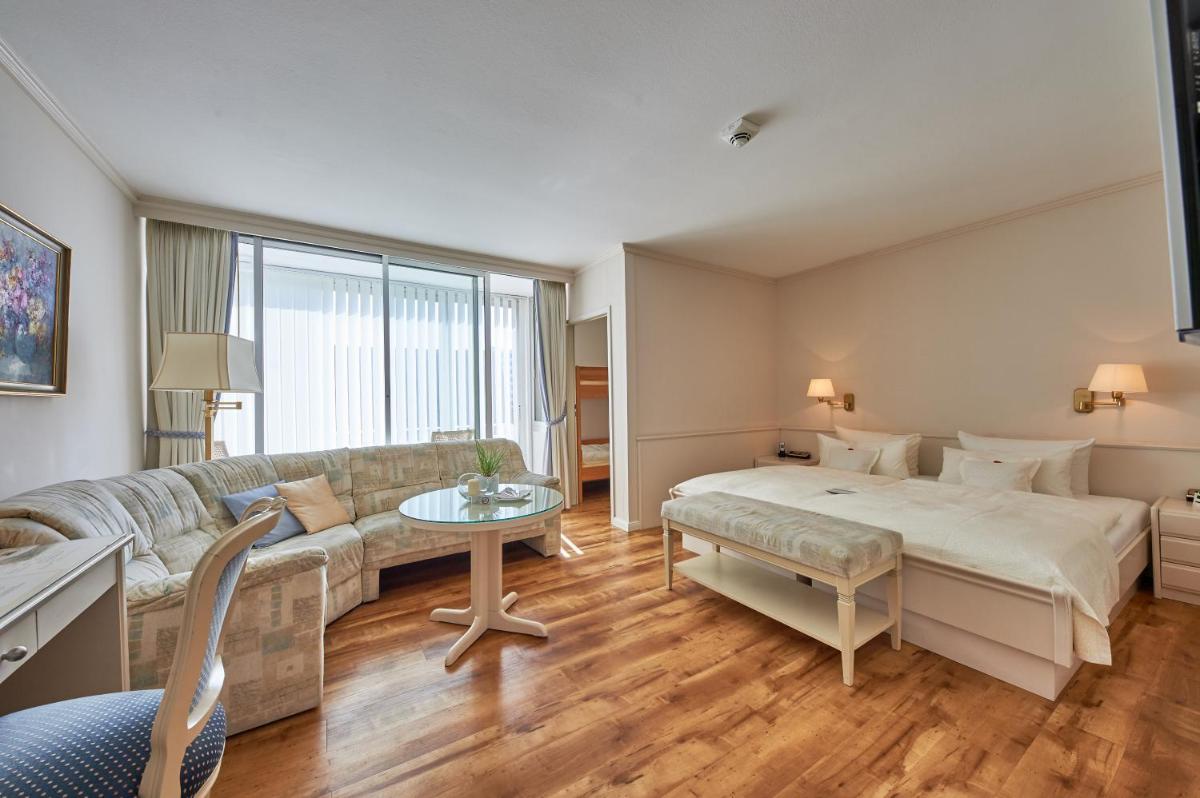 Ein Bett oder Betten in einem Zimmer der Unterkunft Badhotel Sternhagen