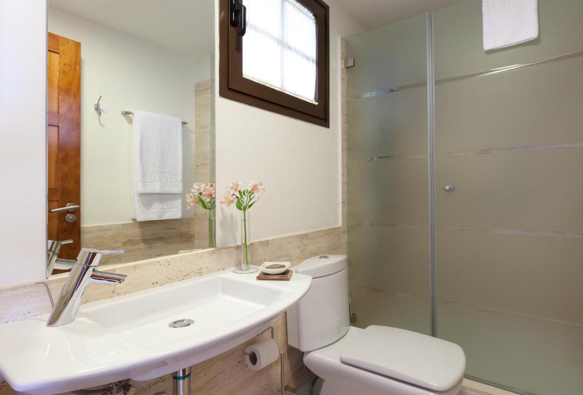 Un baño de Hotel Suite Villa Maria