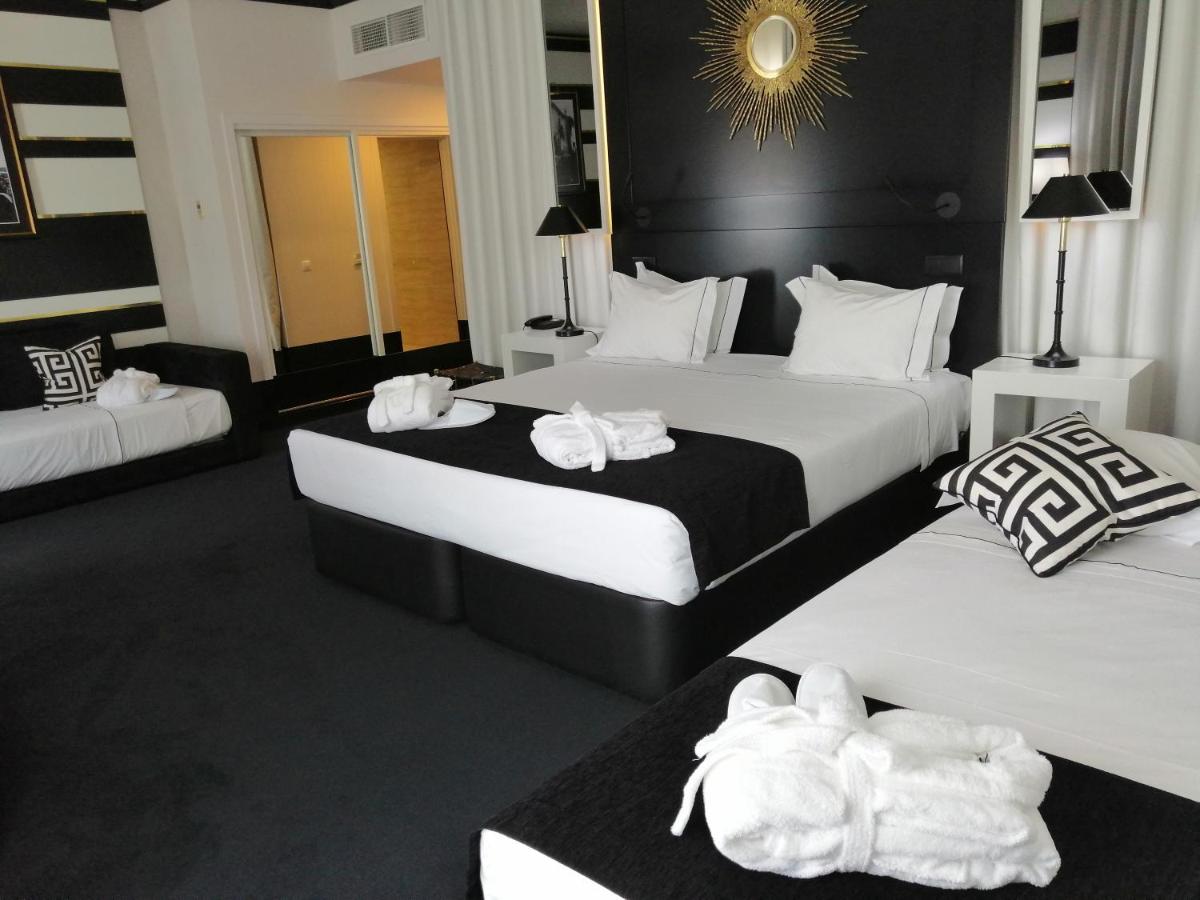 Uma cama ou camas num quarto em Aurea Fatima Hotel Congress & Spa