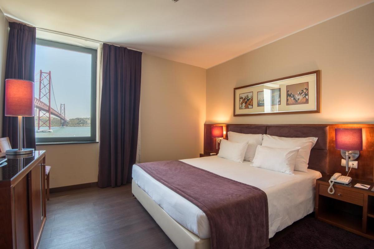 Uma cama ou camas num quarto em Vila Gale Opera