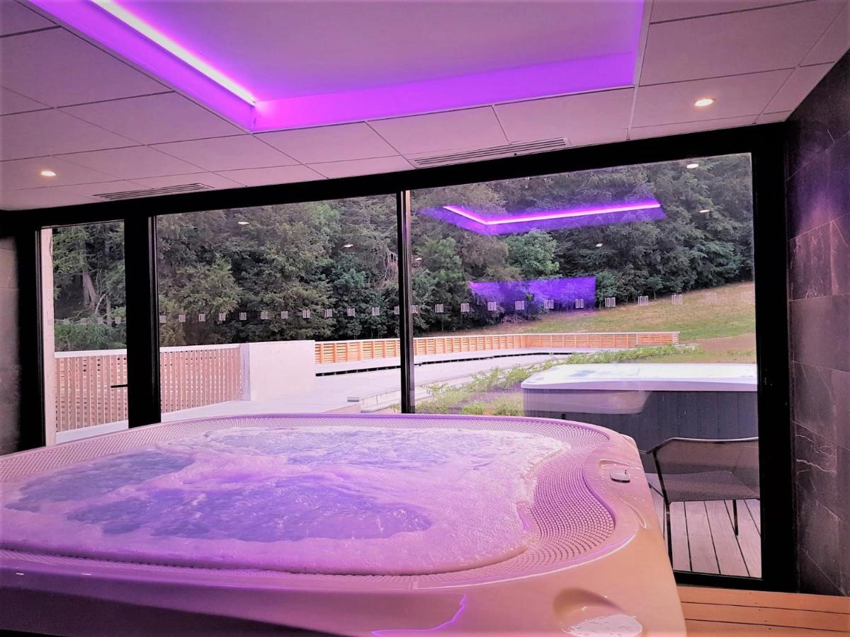 Un ou plusieurs lits dans un hébergement de l'établissement Mildiss Hotel Spa & Restaurant, BW Signature Collection