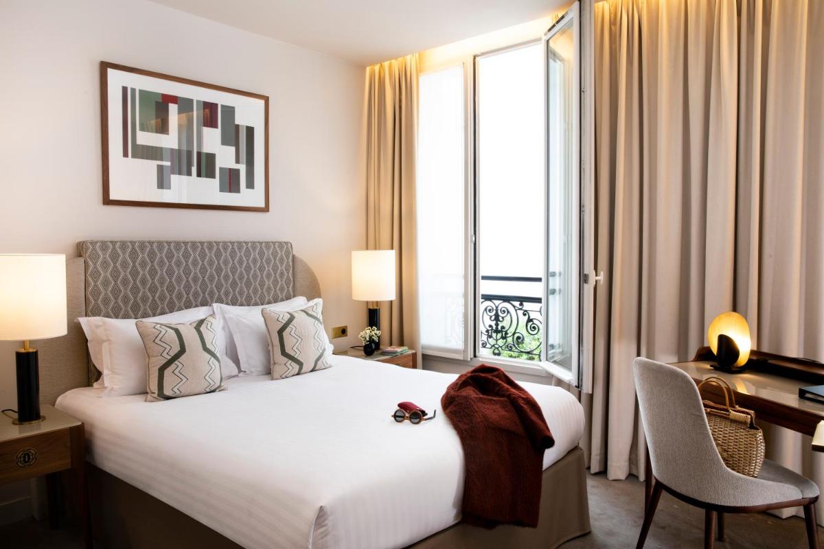 Un ou plusieurs lits dans un hébergement de l'établissement Le Tsuba Hotel