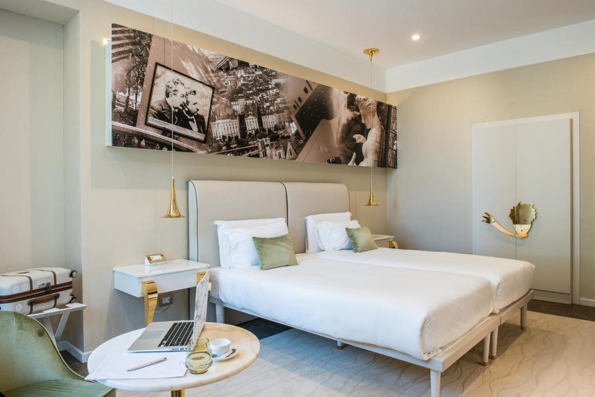 Un ou plusieurs lits dans un hébergement de l'établissement Boscolo Lyon Hotel & Spa