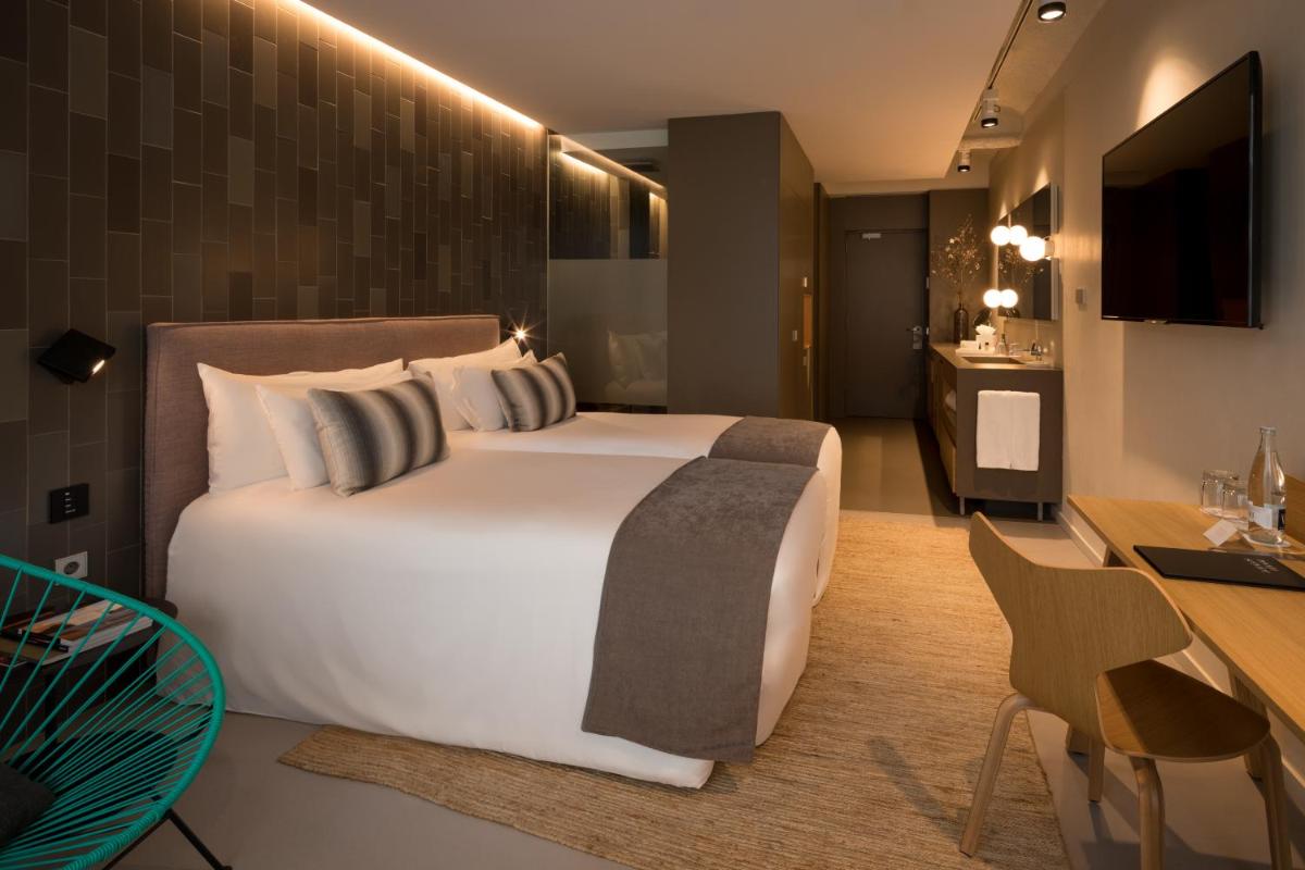 Cama o camas de una habitación en Ohla Eixample