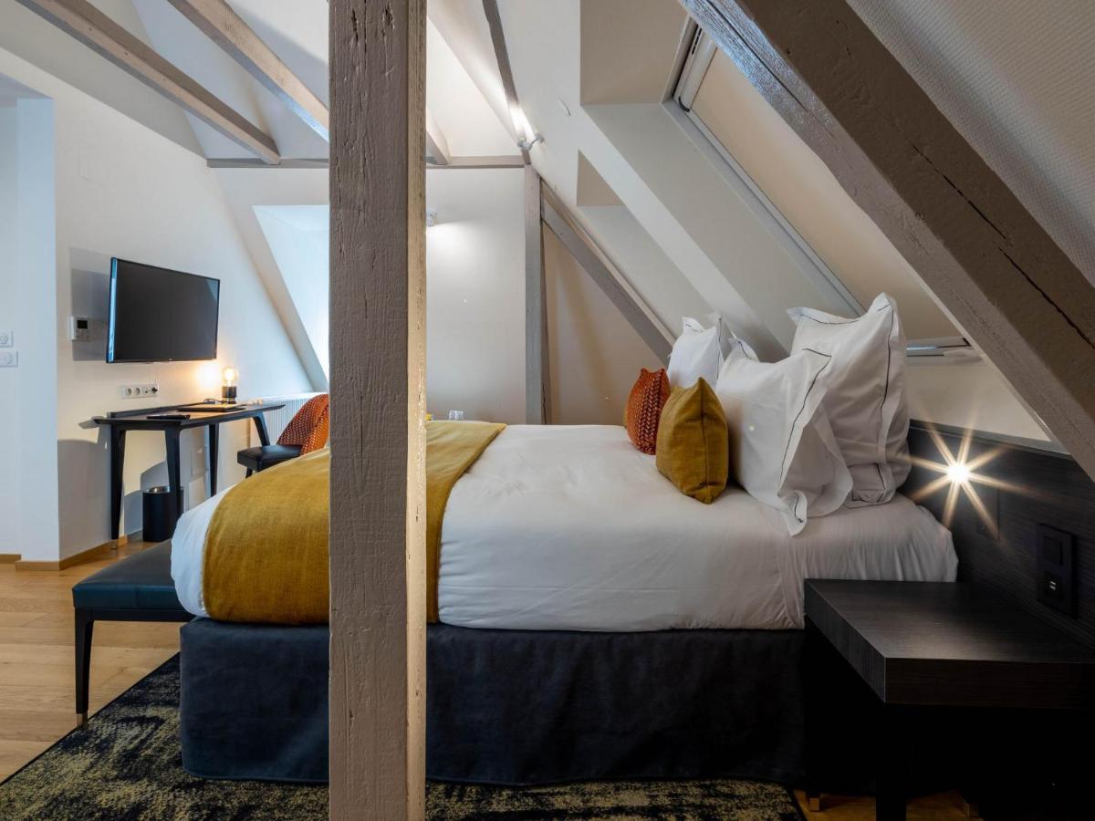 Un ou plusieurs lits dans un hébergement de l'établissement Hôtel Villa La Florangerie - SPA & Piscine