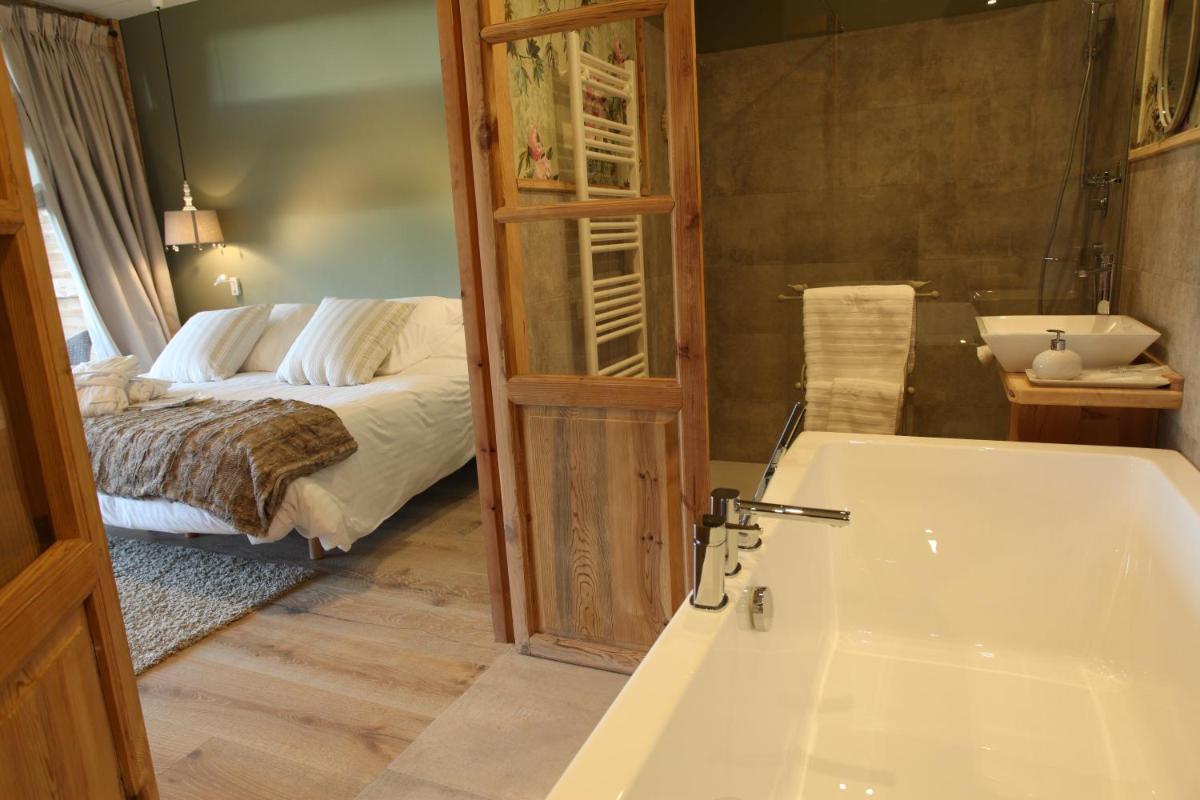 Cama o camas de una habitación en Hotel Viñas de Lárrede