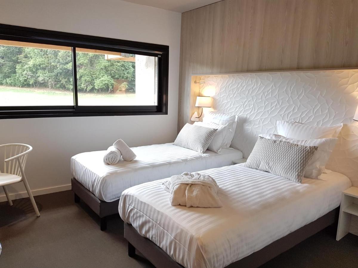 Un ou plusieurs lits dans un hébergement de l'établissement Mildiss Hotel Spa & Restaurant, BW Signature Collection