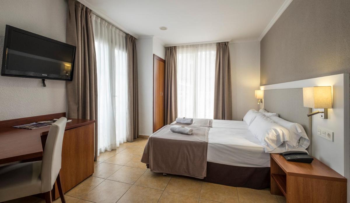 Cama o camas de una habitación en Rosamar & Spa 4*s