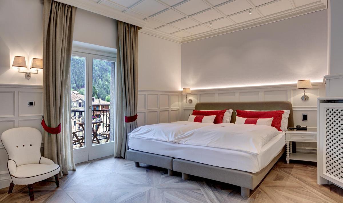 Un ou plusieurs lits dans un hébergement de l'établissement Grand Hôtel des Alpes