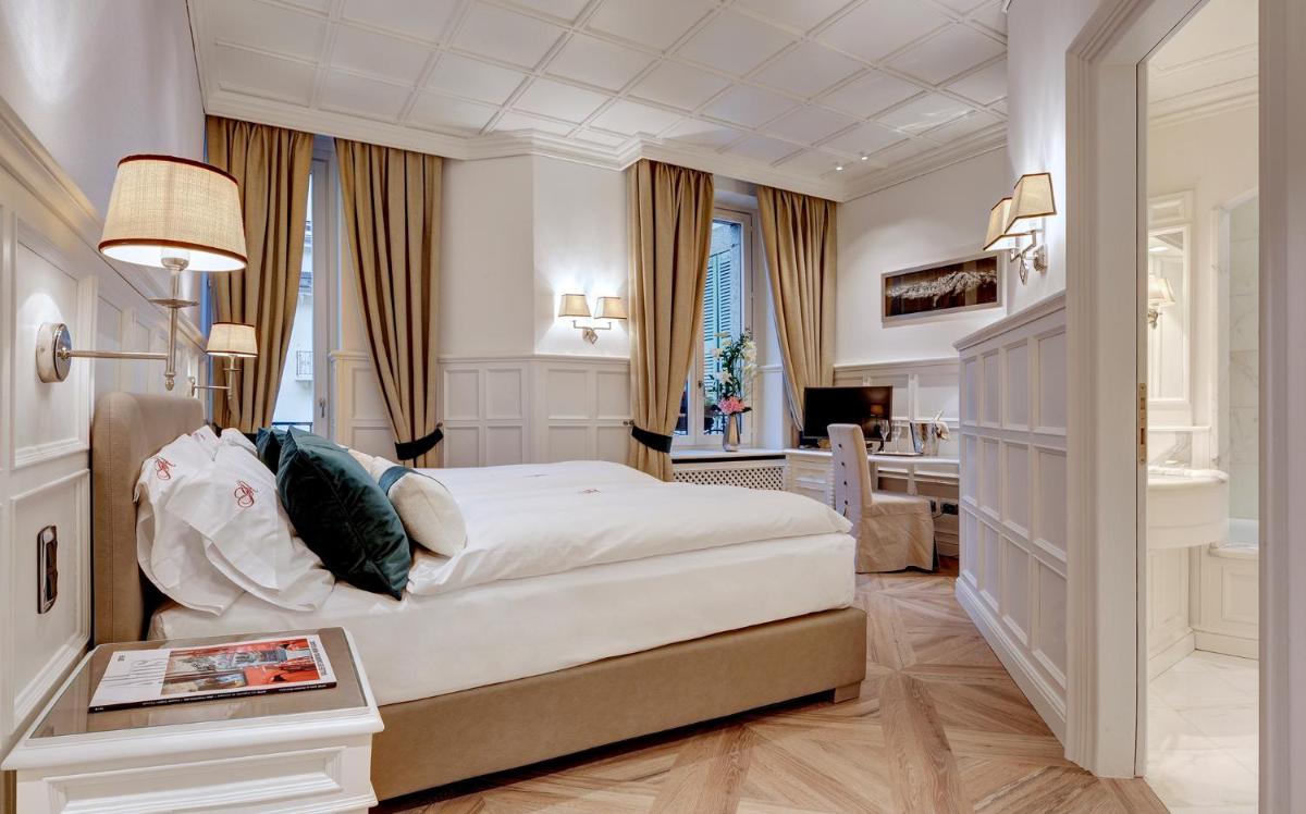 Un ou plusieurs lits dans un hébergement de l'établissement Grand Hôtel des Alpes
