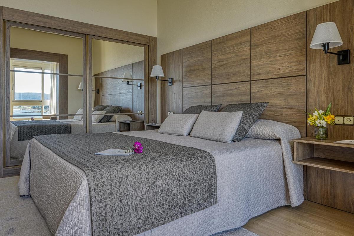 Cama o camas de una habitación en Eurostars Louxo Talaso