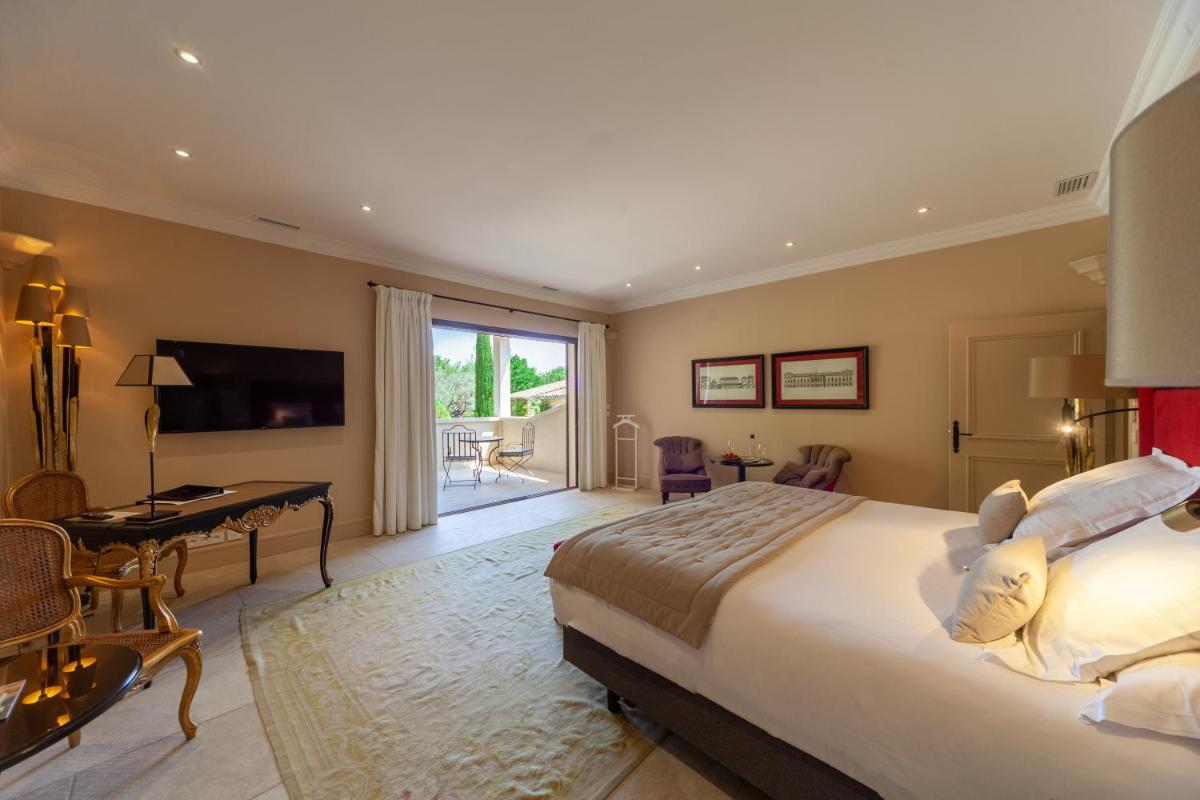 Un ou plusieurs lits dans un hébergement de l'établissement Le Phébus & Spa – Relais & Châteaux