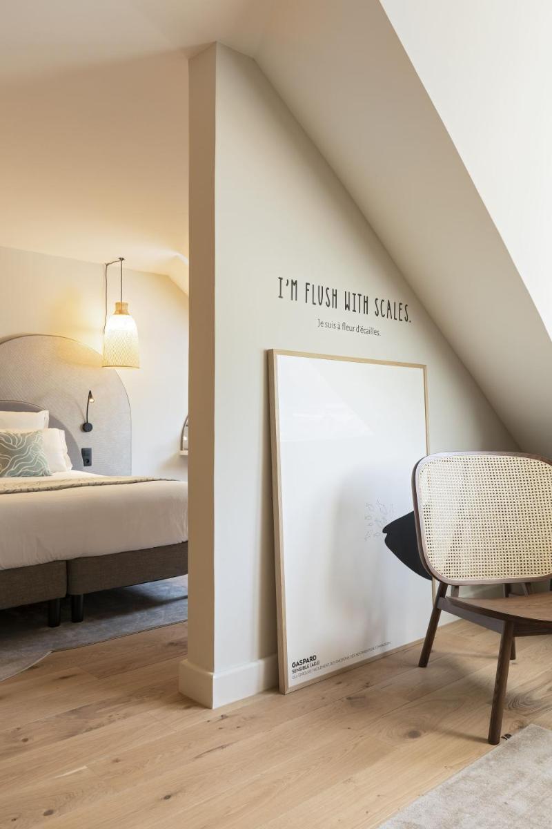 Un ou plusieurs lits dans un hébergement de l'établissement Black Bass Hotel
