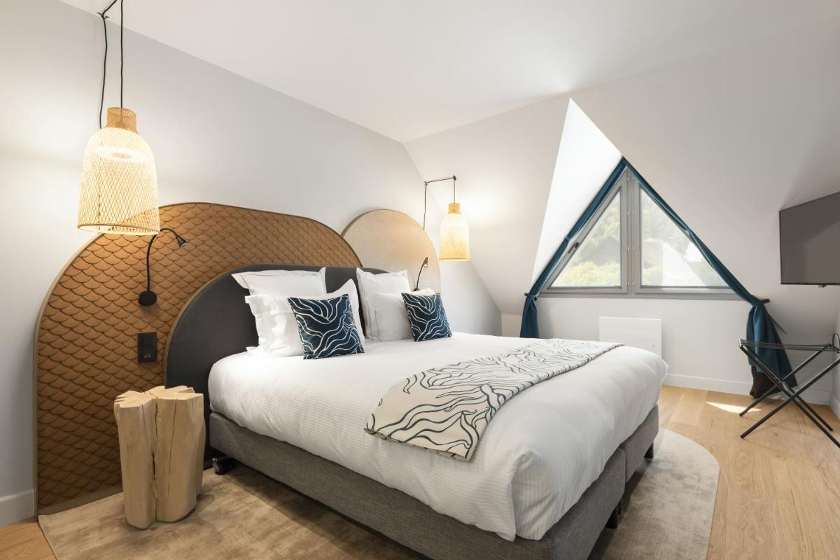 Un ou plusieurs lits dans un hébergement de l'établissement Black Bass Hotel
