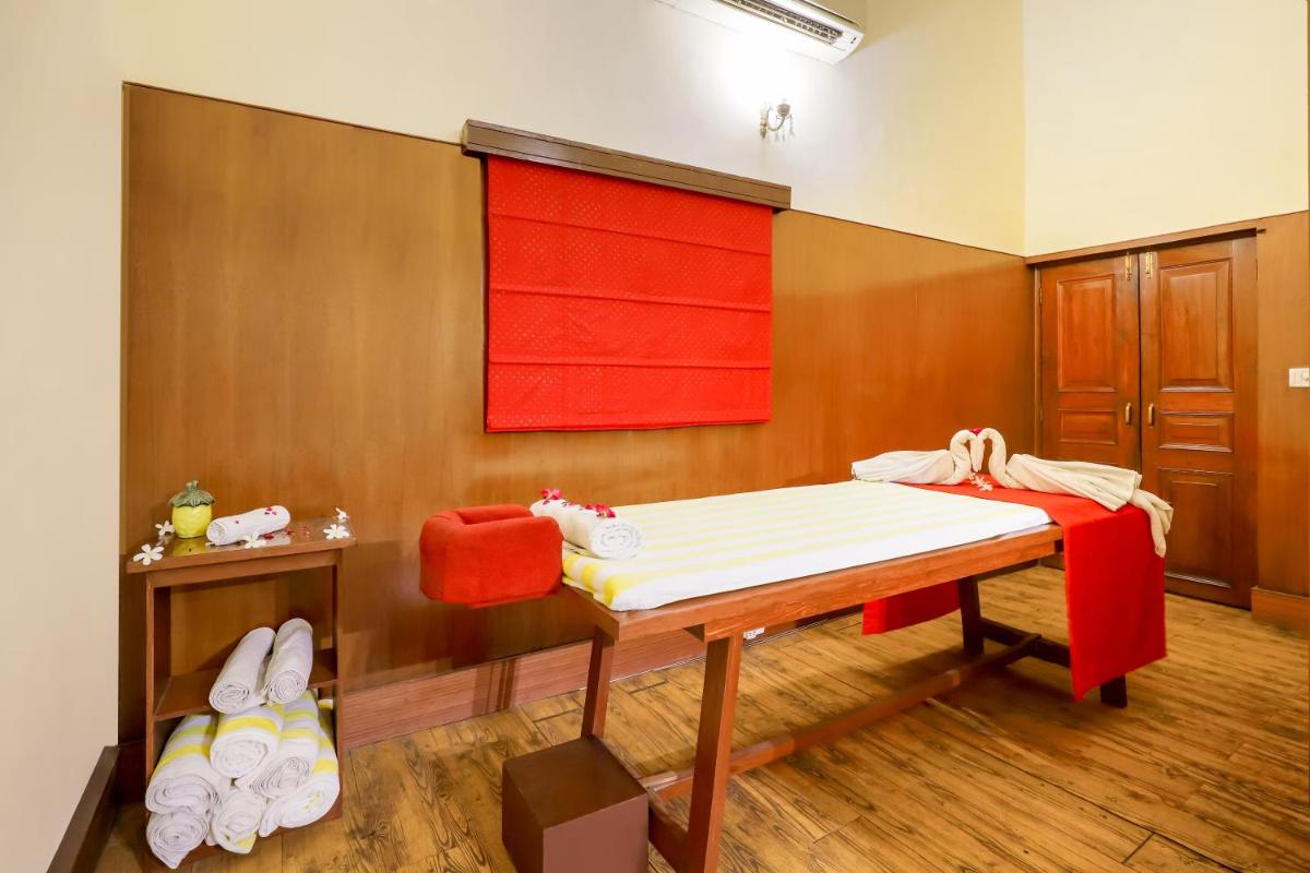 a room with a bed and a table with towels at The Grand Imperial - Heritage Hotel in Agra