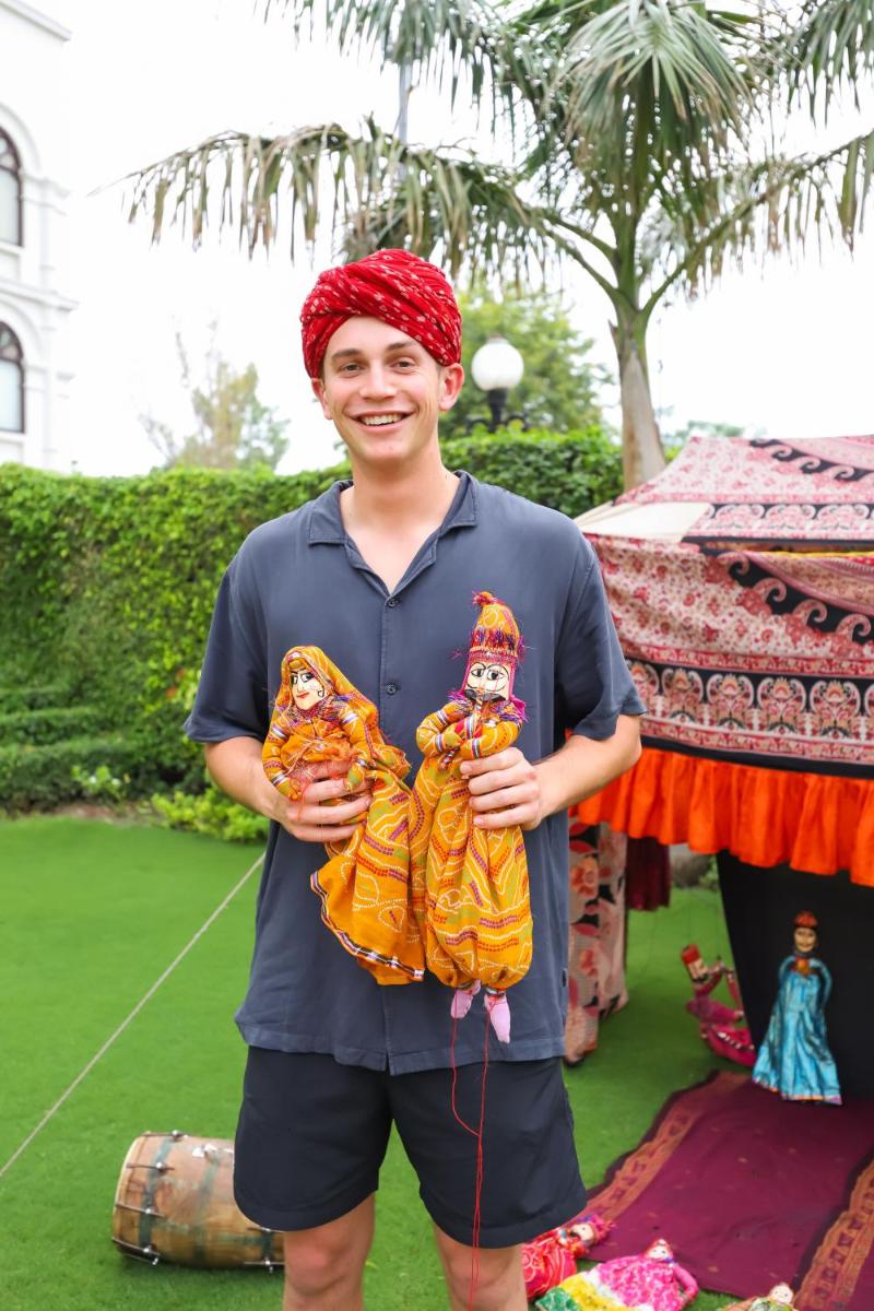 a young man is holding two stuffed animals at The Grand Imperial - Heritage Hotel in Agra