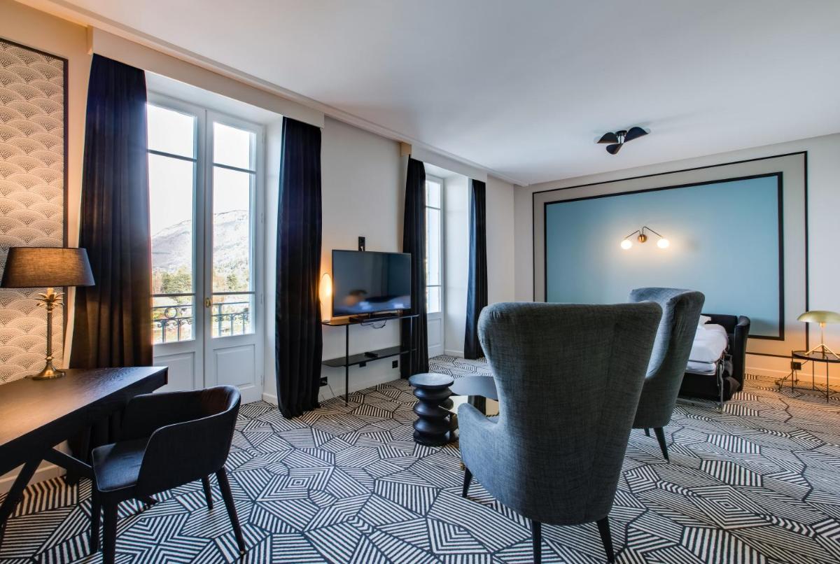 Coin salon dans l'établissement Le Palace De Menthon