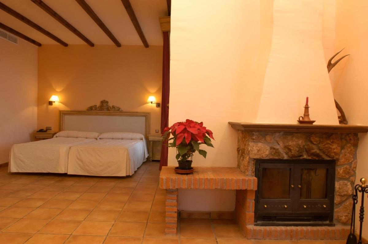 Cama o camas de una habitación en Hotel Rural Los Nogales