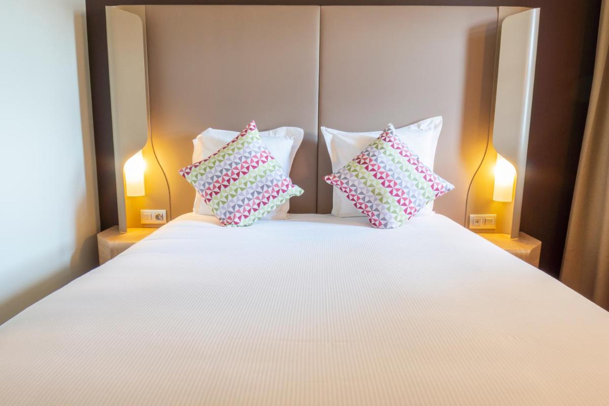Un ou plusieurs lits dans un hébergement de l'établissement Hotel Campanile Montpellier Centre St Roch