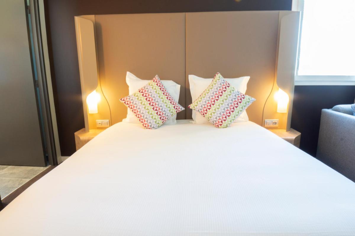 Un ou plusieurs lits dans un hébergement de l'établissement Hotel Campanile Montpellier Centre St Roch