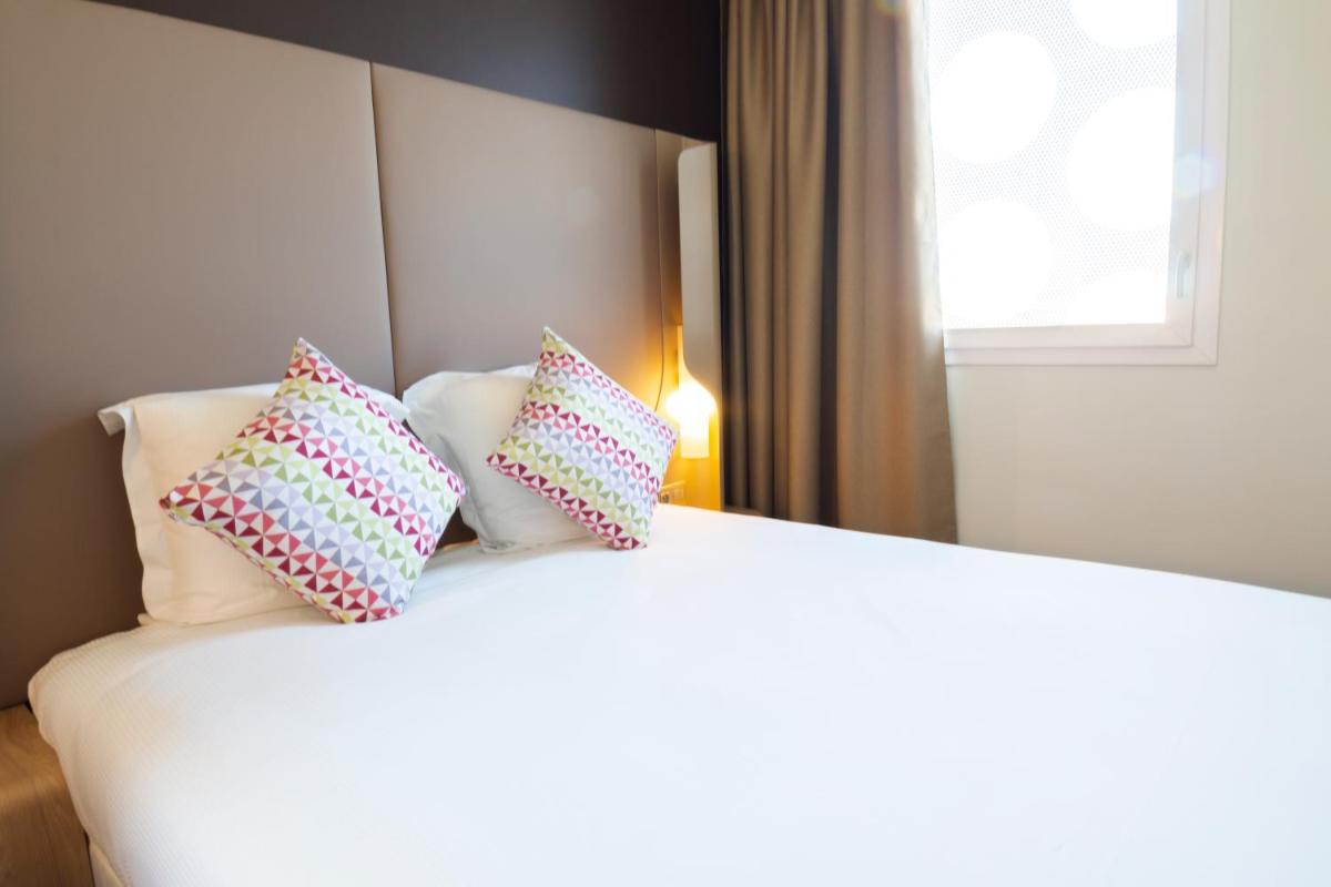 Un ou plusieurs lits dans un hébergement de l'établissement Hotel Campanile Montpellier Centre St Roch
