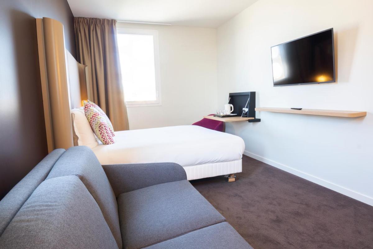 Télévision ou salle de divertissement dans l'établissement Hotel Campanile Montpellier Centre St Roch