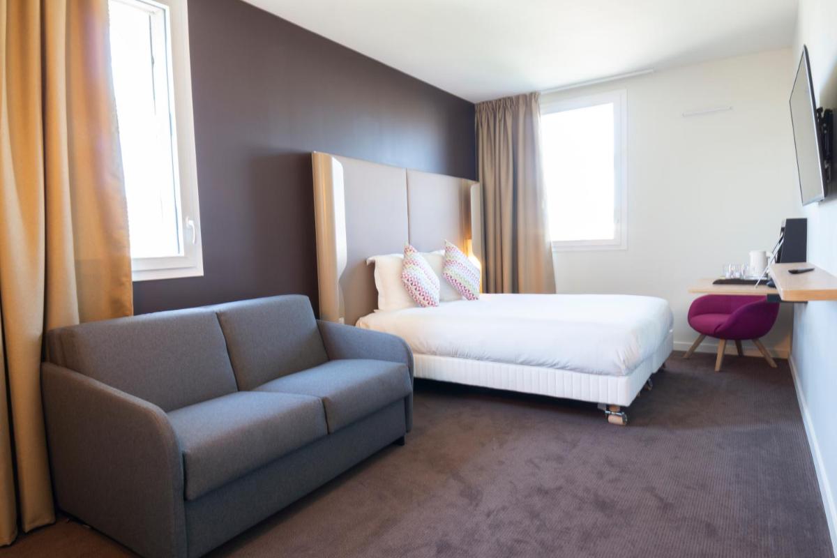 Un ou plusieurs lits dans un hébergement de l'établissement Hotel Campanile Montpellier Centre St Roch